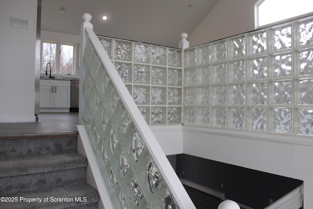 stairs featuring recessed lighting, visible vents, and lofted ceiling