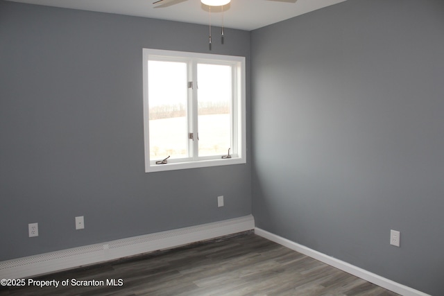 unfurnished room with ceiling fan, baseboards, and wood finished floors