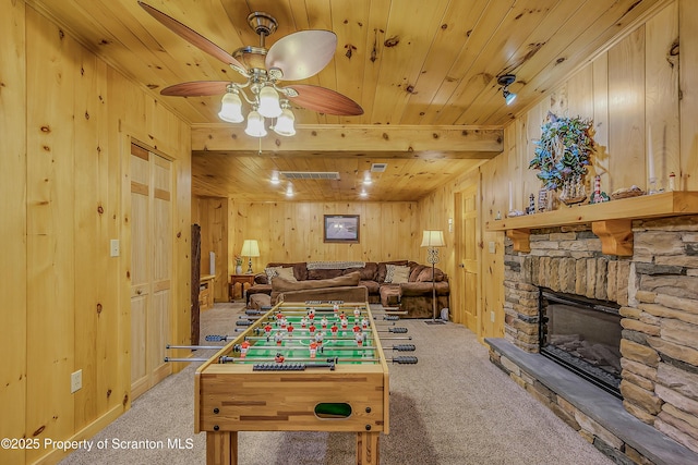 5 Capricorn Cir, Lake Ariel, PA 18436 - playroom with wooden walls, wood ceiling, light carpet, a ceiling fan, and a stone fireplace