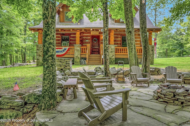 5 Capricorn Cir, Lake Ariel, PA 18436 - porch with a fire pit and a lawn