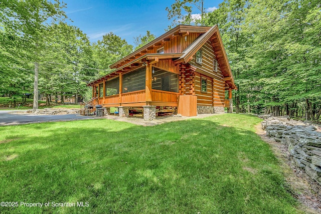 5 Capricorn Cir, Lake Ariel, PA 18436 - view of property exterior with a yard, log siding, and board and batten siding