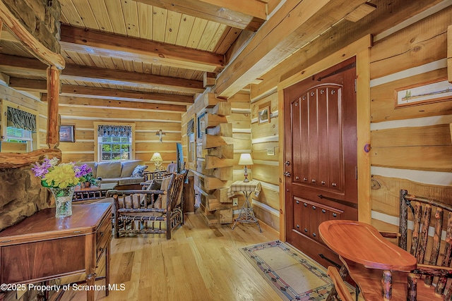 5 Capricorn Cir, Lake Ariel, PA 18436 - living room featuring light wood-style floors, wood walls, and a wooden ceiling with exposed beams
