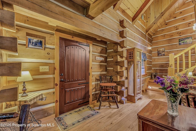 5 Capricorn Cir, Lake Ariel, PA 18436 - foyer entrance with wood walls, light wood-style floors, and stairway