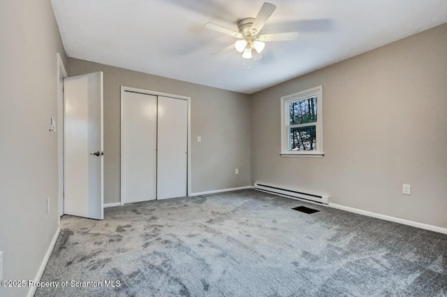 unfurnished bedroom with light carpet, ceiling fan, and a baseboard heating unit