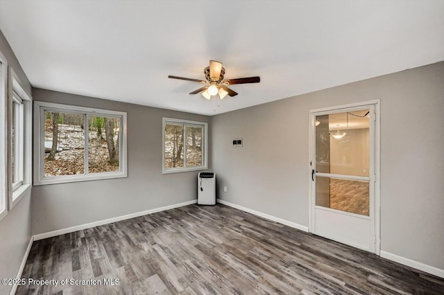 unfurnished room with wood-type flooring and ceiling fan