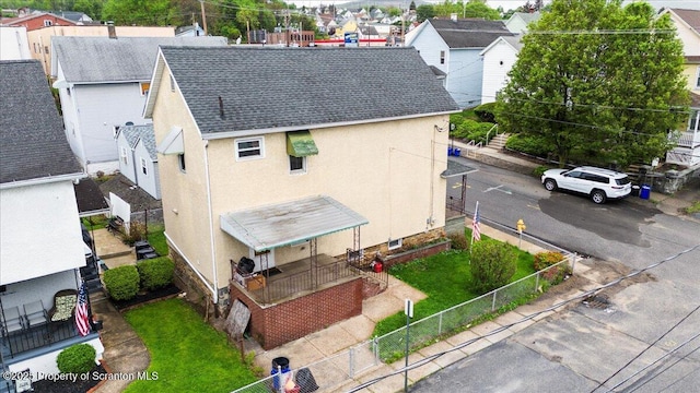 birds eye view of property with a residential view