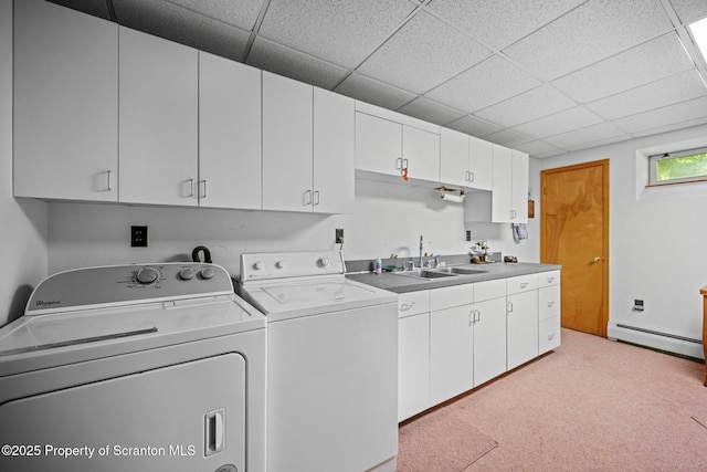 32 Christy Ln, Scott Twp, PA 18447 - laundry area with a baseboard heating unit, independent washer and dryer, cabinet space, and light colored carpet
