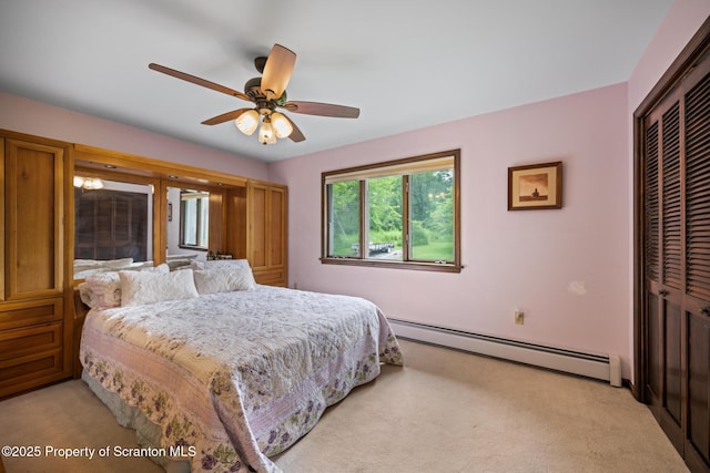 32 Christy Ln, Scott Twp, PA 18447 - bedroom featuring baseboard heating, a closet, light carpet, and ceiling fan