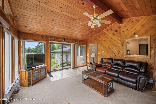 32 Christy Ln, Scott Twp, PA 18447 - carpeted living room featuring wood walls, a ceiling fan, wooden ceiling, baseboard heating, and tile patterned flooring