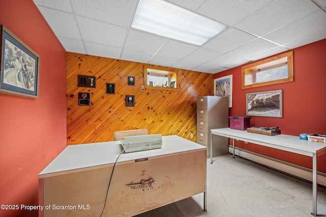 32 Christy Ln, Scott Twp, PA 18447 - office space featuring carpet flooring, a paneled ceiling, wood walls, and a baseboard radiator