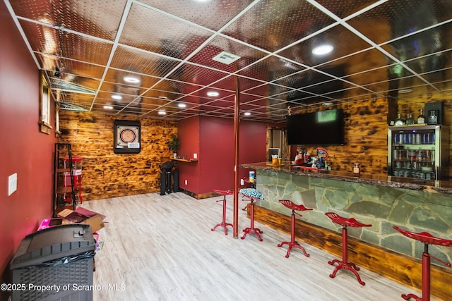 240 R Hirkey Rd, Meshoppen, PA 18630 - indoor dry bar featuring wood walls and wood finished floors