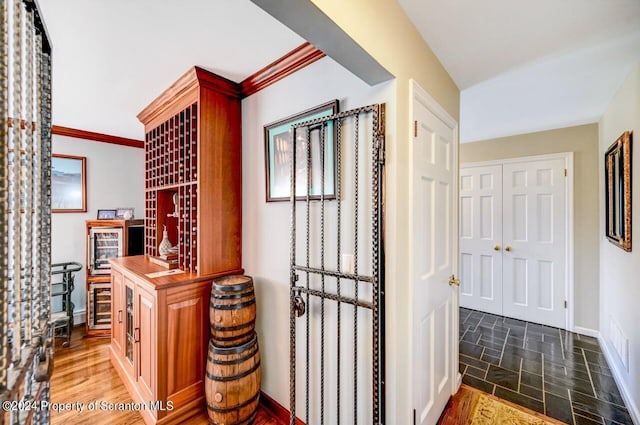 wine area featuring ornamental molding