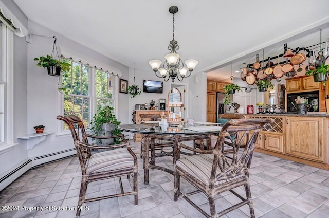 dining space featuring an inviting chandelier