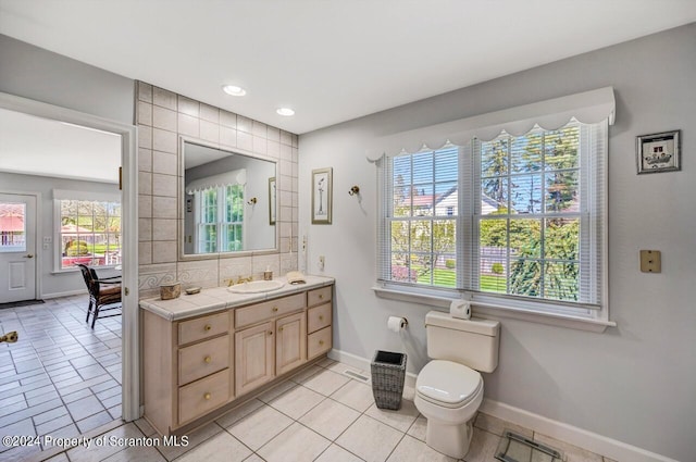 bathroom featuring tile patterned floors, vanity, and toilet