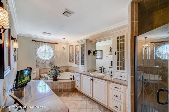 bathroom with tile patterned floors, an inviting chandelier, independent shower and bath, and ornamental molding