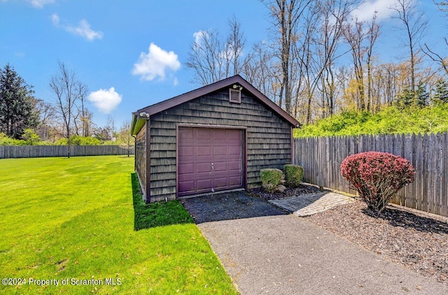 garage featuring a lawn