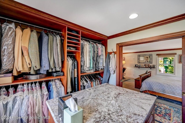 walk in closet featuring carpet