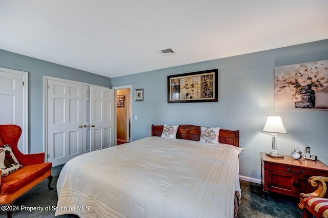 bedroom featuring dark colored carpet