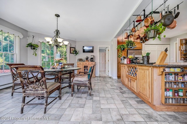 dining space featuring a notable chandelier