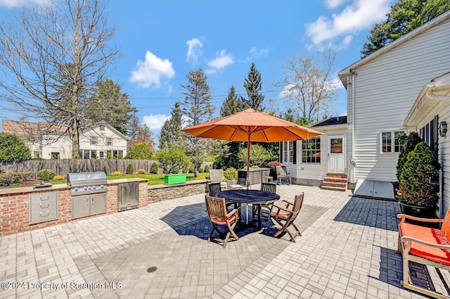 view of patio featuring an outdoor kitchen and area for grilling