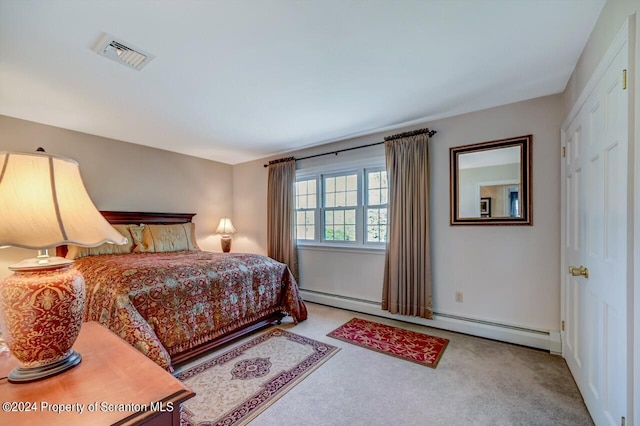 bedroom with carpet and a baseboard radiator