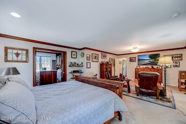 bedroom with carpet floors and crown molding