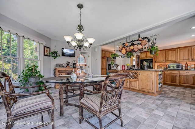 dining room featuring a notable chandelier