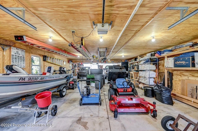 garage featuring a workshop area and a garage door opener