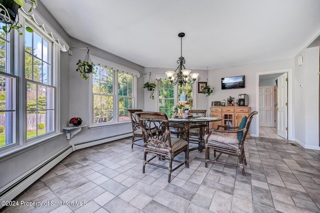 dining area featuring baseboard heating and an inviting chandelier