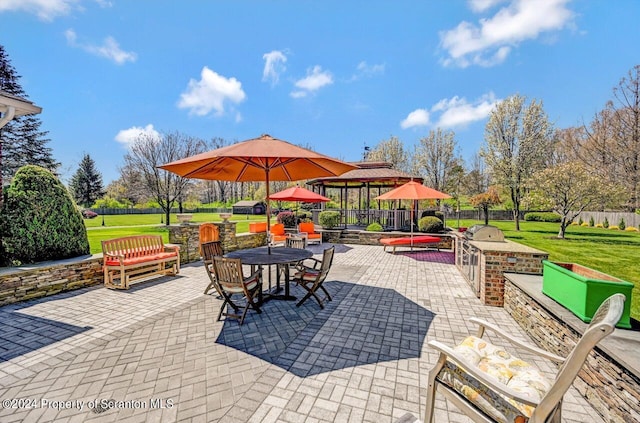 view of patio featuring a gazebo and exterior kitchen