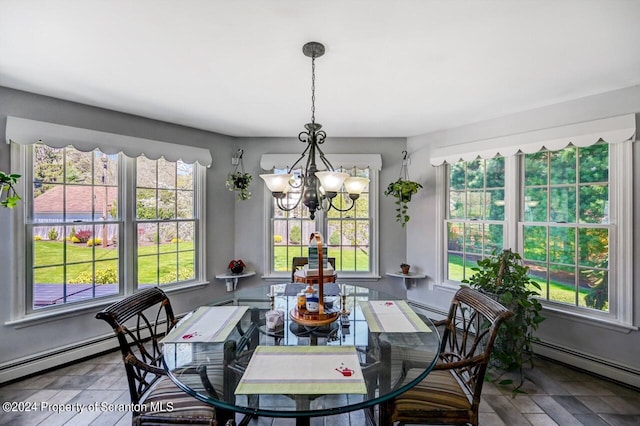 dining area featuring a baseboard radiator and an inviting chandelier