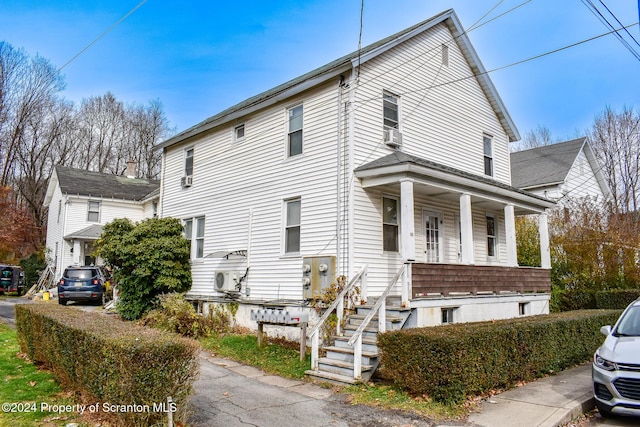 view of side of home featuring a porch