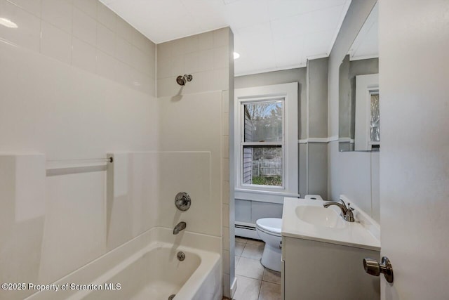 full bath featuring bathing tub / shower combination, toilet, vanity, a baseboard heating unit, and tile patterned floors