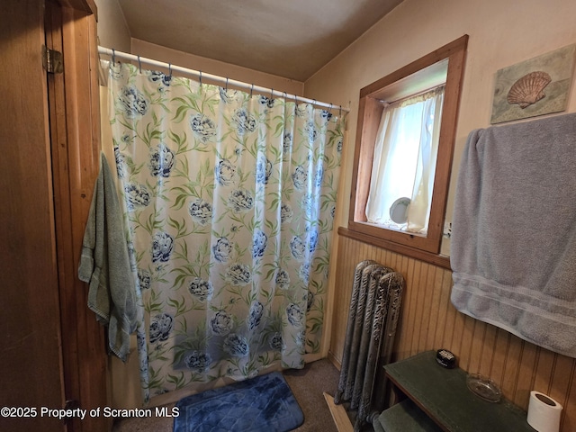 4 Little Ireland Rd, Starrucca, PA 18462 - bathroom featuring a shower with curtain, wood walls, and wainscoting