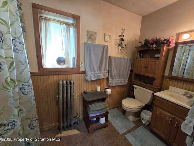 4 Little Ireland Rd, Starrucca, PA 18462 - bathroom with radiator, vanity, a wainscoted wall, toilet, and wooden walls