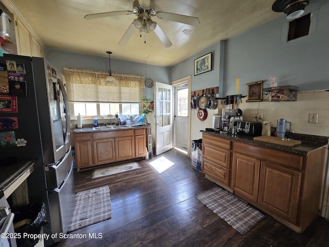4 Little Ireland Rd, Starrucca, PA 18462 - kitchen with dark countertops, a ceiling fan, freestanding refrigerator, dark wood-type flooring, and a sink