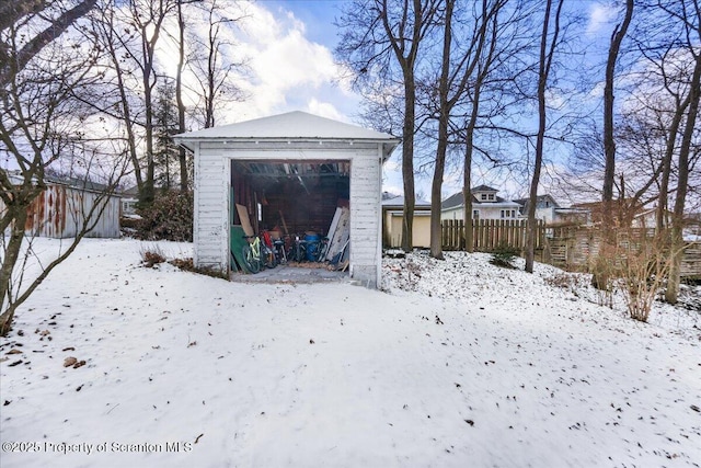 view of snow covered garage