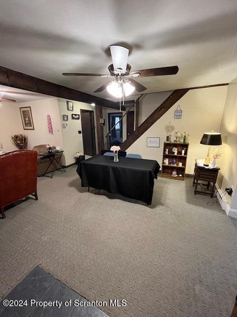 carpeted bedroom with beamed ceiling, ceiling fan, and billiards