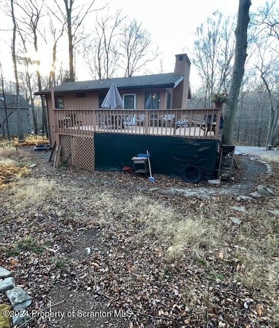 back of property with a deck