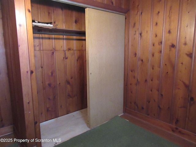 interior space featuring wood walls