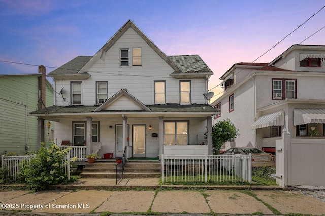 215 St Fr Cabrini Ave Unit Fr, Cabrini, Scranton, PA 18504 - view of front of property with covered porch, a fenced front yard, and roof with shingles