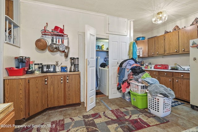 215 St Fr Cabrini Ave Unit Fr, Cabrini, Scranton, PA 18504 - kitchen featuring brown cabinetry, light countertops, light tile patterned floors, freestanding refrigerator, and washer / clothes dryer