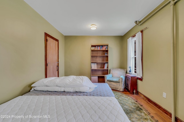 bedroom with light hardwood / wood-style flooring