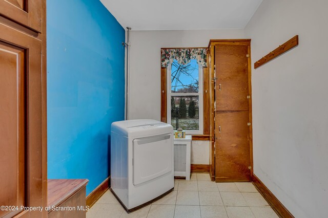 washroom with washer / dryer