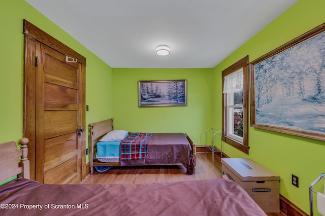 bedroom with light hardwood / wood-style floors