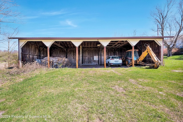 view of outbuilding with a yard