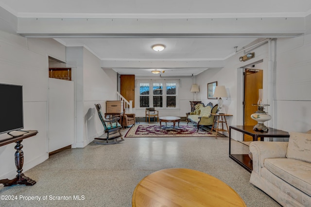 living room with beamed ceiling