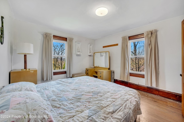 bedroom with light hardwood / wood-style floors