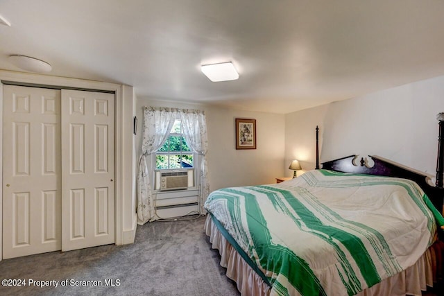 carpeted bedroom with baseboard heating, a closet, and cooling unit