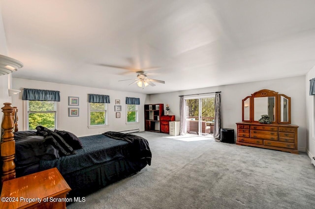 bedroom with access to outside, multiple windows, ceiling fan, and carpet floors